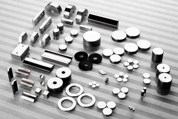 Stabilizing elements and methods of permanent magnet materials